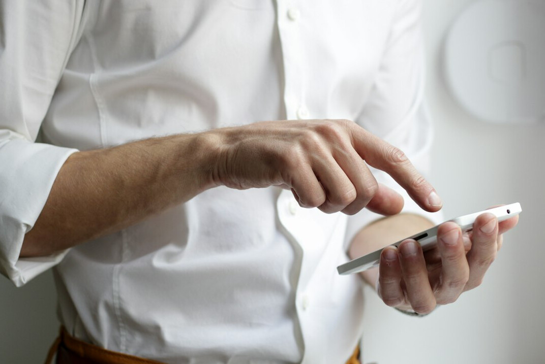 person checking news on phone