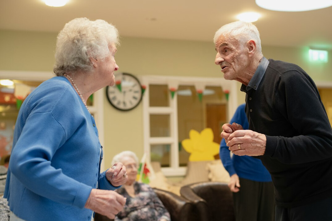 volunteers visiting elderly person