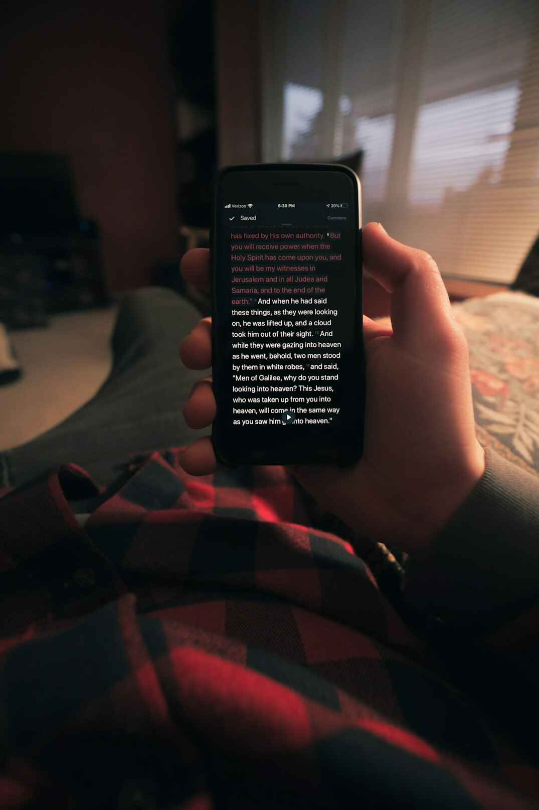 person reading fake news on phone
