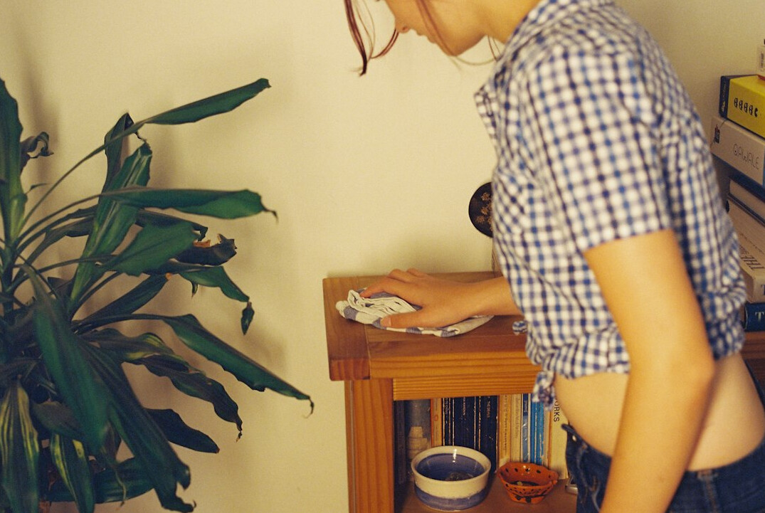 Journalist analysing documents and a laptop at a newsroom desk